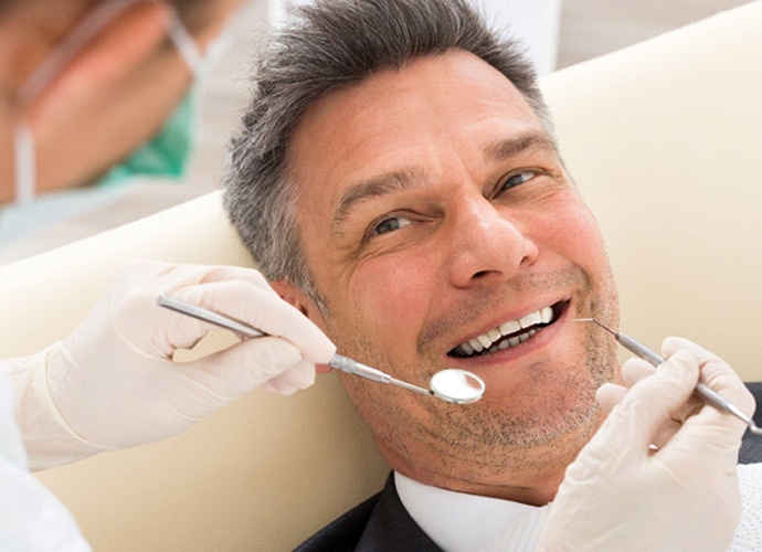 Man at dental office for dental crown in Palo Alto