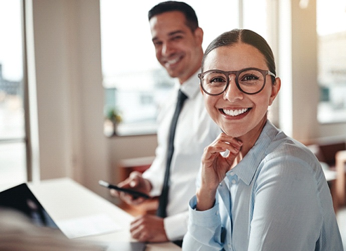 Woman smiling with dental crown in Palo Alto