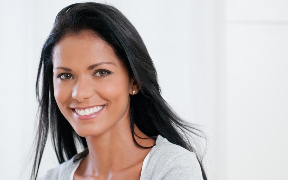 Woman with flawless smile after cosmetic dentistry