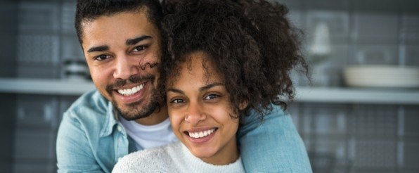 Man and woman with flawless smiles after cosmetic dentistry