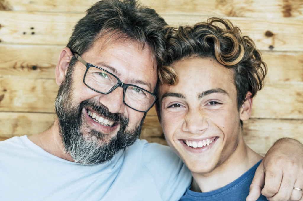 father and son smiling